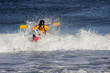 Kayaker on the crest of a wave
