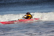 Kayaker in action on rough sea