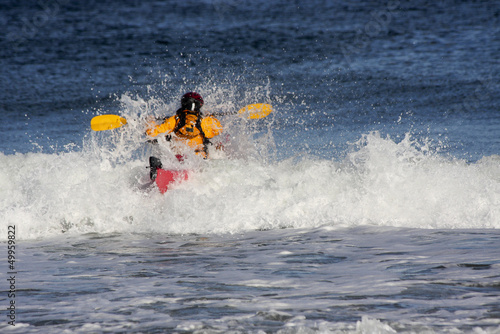 Photo: Kayaker on the crest of a wave Kayaker on the crest of a wave