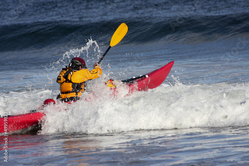 Photo: Man fighting the wave on kayak Man fighting the wave on kayak