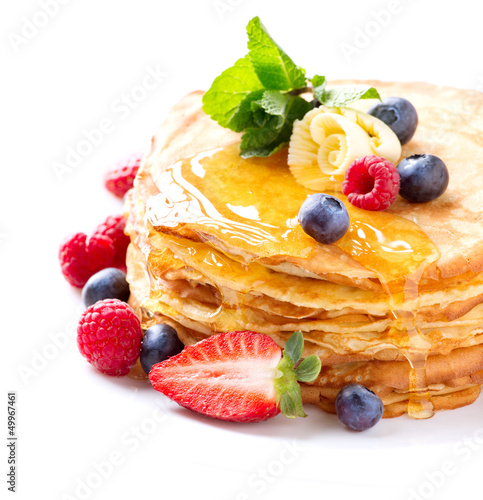 Photo: Pancake with Berries. Pancakes Stack over White Pancake with Berries. Pancakes Stack over White