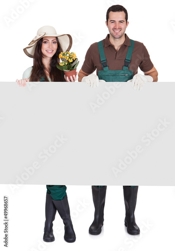 Photo: Portrait of male and female gardeners Portrait of male and female gardeners