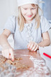 Young girl pointing to gingerbread shape