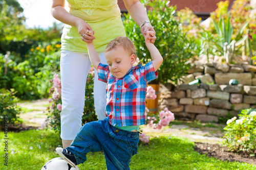 Photo: Family - mother and child in garden Family - mother and child in garden