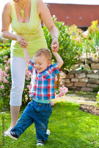 Photo: Family - mother and child in garden Family - mother and child in garden