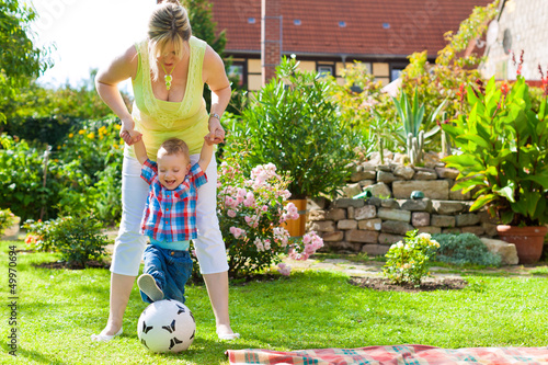 Photo: Family - mother and child in garden Family - mother and child in garden