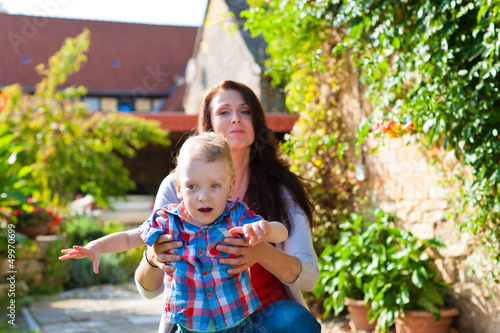 Photo: Family - mother and child in garden Family - mother and child in garden