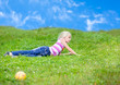 Girl lying on the grass looking to the side