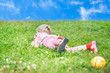 Girl lying on the grass looking to the side