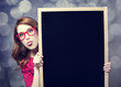 Redhead student with blackboard.