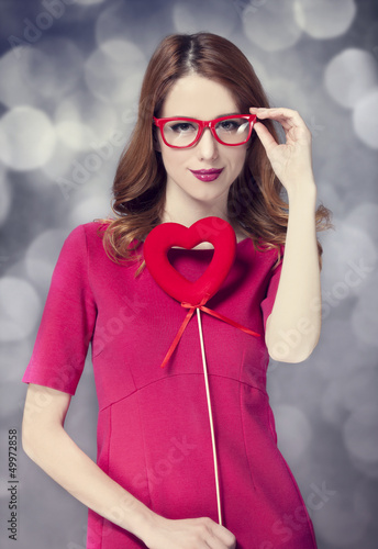 Photo: Beautiful redhead girl with two hearts. Beautiful redhead girl with two hearts.
