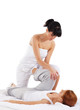A young redhead woman on a Thai massage procedure