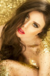 Magic Girl Portrait in Gold. Golden Makeup