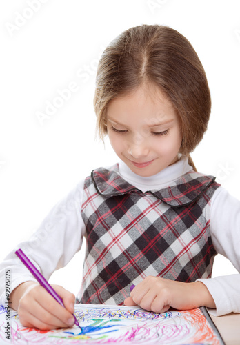 Photo: little girl draws felt-tip pen on paper little girl draws felt-tip pen on paper