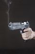 hand with gun