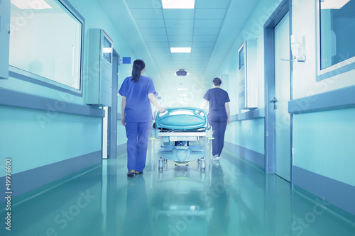 Photo: Bright lights at the end the hospital corridor. The concept of l Bright lights at the end the hospital corridor. The concept of l