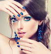 Model with blue make-up and manicure