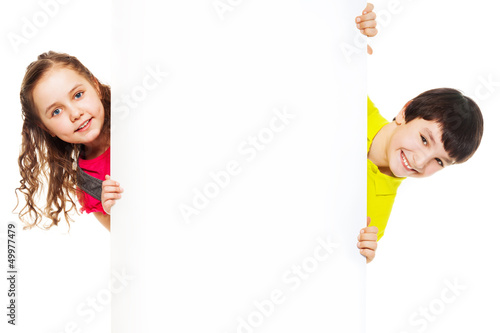 Photo: Two kids with blank ad board Two kids with blank ad board
