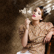 Pinup portrait of a smoking woman blowing hearts