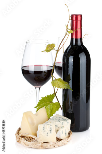 Photo: Red wine bottle, glasses and cheese Red wine bottle, glasses and cheese