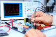 Tech tests electronic equipment