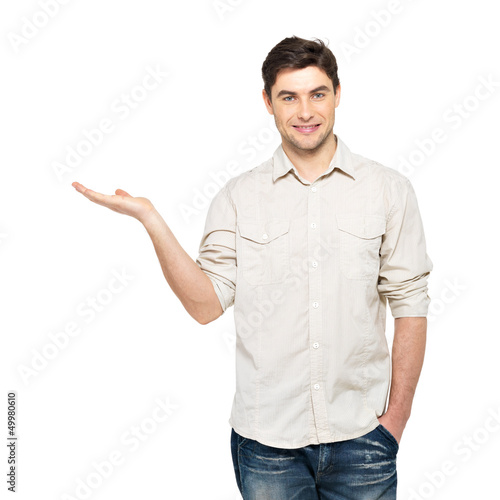 Photo: man shows something on palm isolated on white man shows something on palm isolated on white