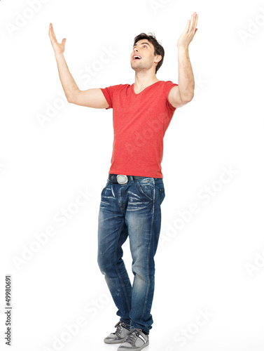 Photo: man with in casuals with raised hands up isolated man with in casuals with raised hands up isolated