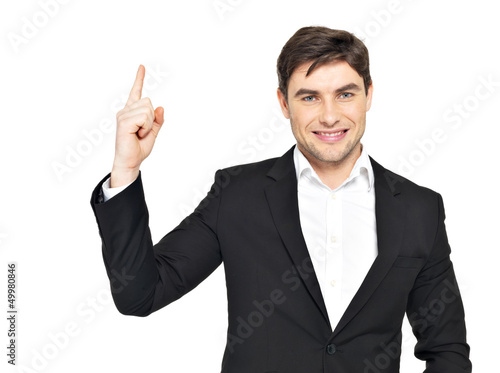 Photo: portrait of businessman points his finger up portrait of businessman points his finger up