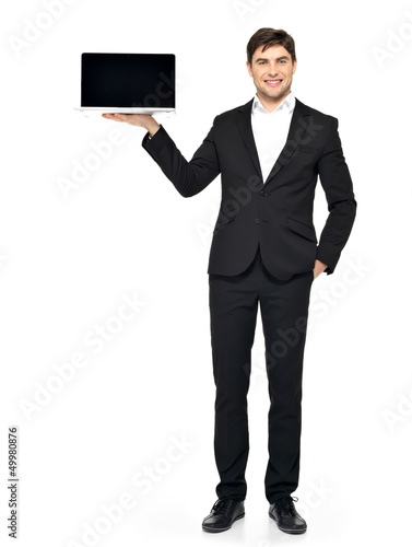 Photo: businessman holds on palm the opened laptop businessman holds on palm the opened laptop