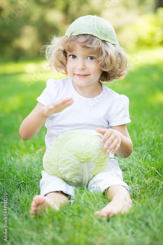 Photo: Child with white cabbage Child with white cabbage