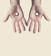 Two hands with holes.