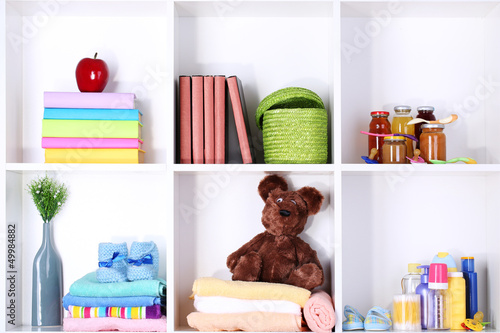 Photo: Beautiful white shelves with different baby related objects Beautiful white shelves with different baby related objects