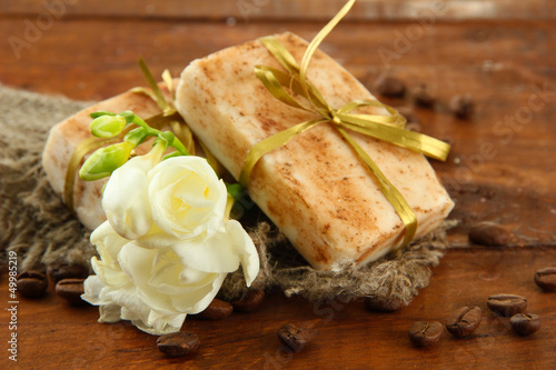 Photo: Natural handmade soap, on wooden background Natural handmade soap, on wooden background