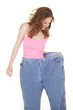 Foto: Woman pink top look down big pants Woman pink top look down big pants