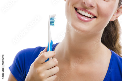 Photo: Beautiful woman with a toothbrush Beautiful woman with a toothbrush