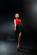 Photo: art fashion photo of young woman on dark background art fashion photo of young woman on dark background