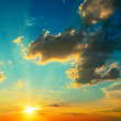 Photo: Clouds illuminated by sunlight. Sunset. Clouds illuminated by sunlight. Sunset.