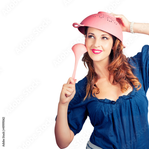 Photo: Isolated woman straining for creative cooking idea Isolated woman straining for creative cooking idea