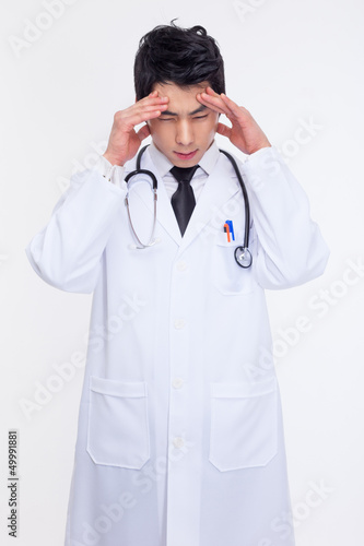 Photo: Young Asian doctor having a stress Young Asian doctor having a stress