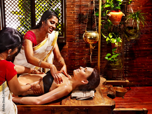 Photo: Woman having Ayurvedic spa treatment. Woman having Ayurvedic spa treatment.