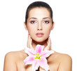 Beauty face of young woman with flower. Beauty treatment concept