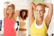 Photo: Pretty girl exercising in group Pretty girl exercising in group