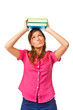 Portrait of female college student carrying a pile of books over