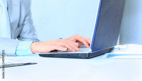 Photo: The businessman at the age of works for the laptop. The businessman at the age of works for the laptop.