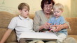 Granny with kids painting at home