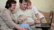 Family using laptop at home