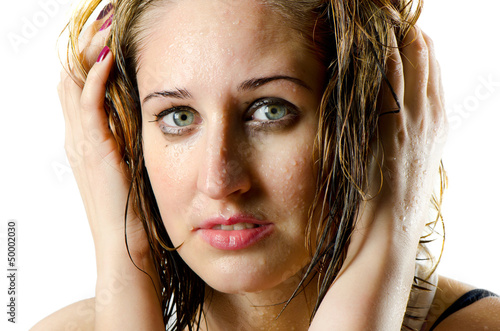 Photo: Beautiful woman's face with water drops Beautiful woman's face with water drops