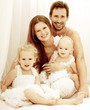 Happy young family. Indoors.