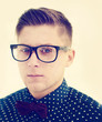 handsome guy with glasses and a fashionable hairdo