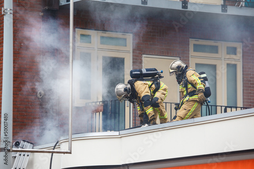 Photo: Two firemen Two firemen